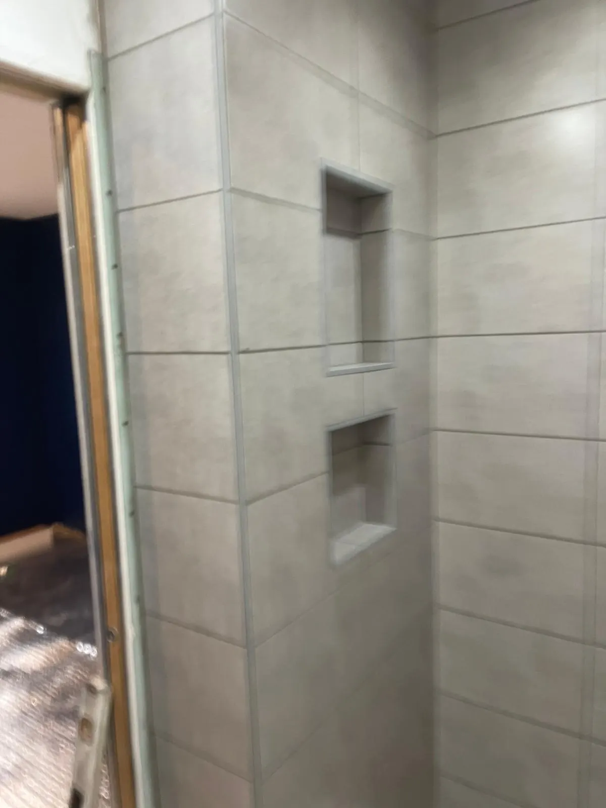 Bathroom wall tiling — client-supplied L&G project photograph