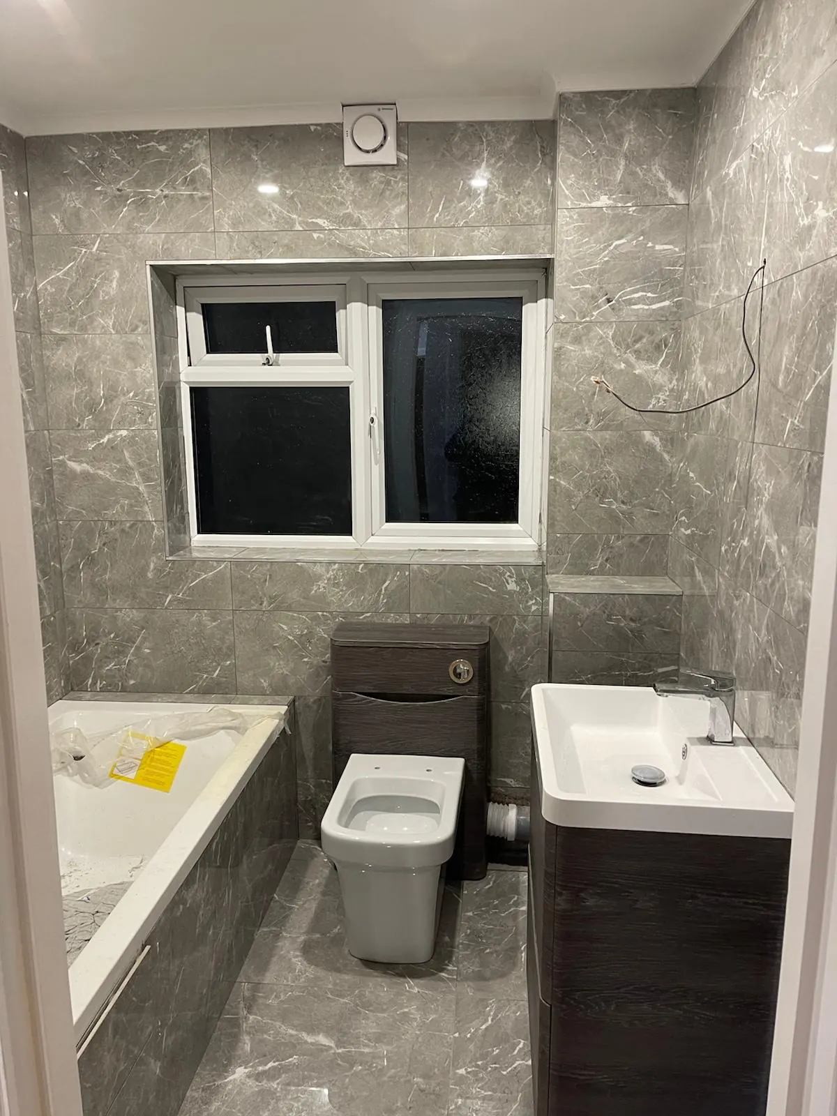 Bathroom tiling in progress