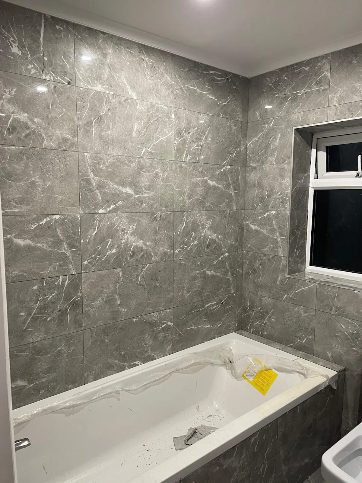 Bathroom tiling in progress