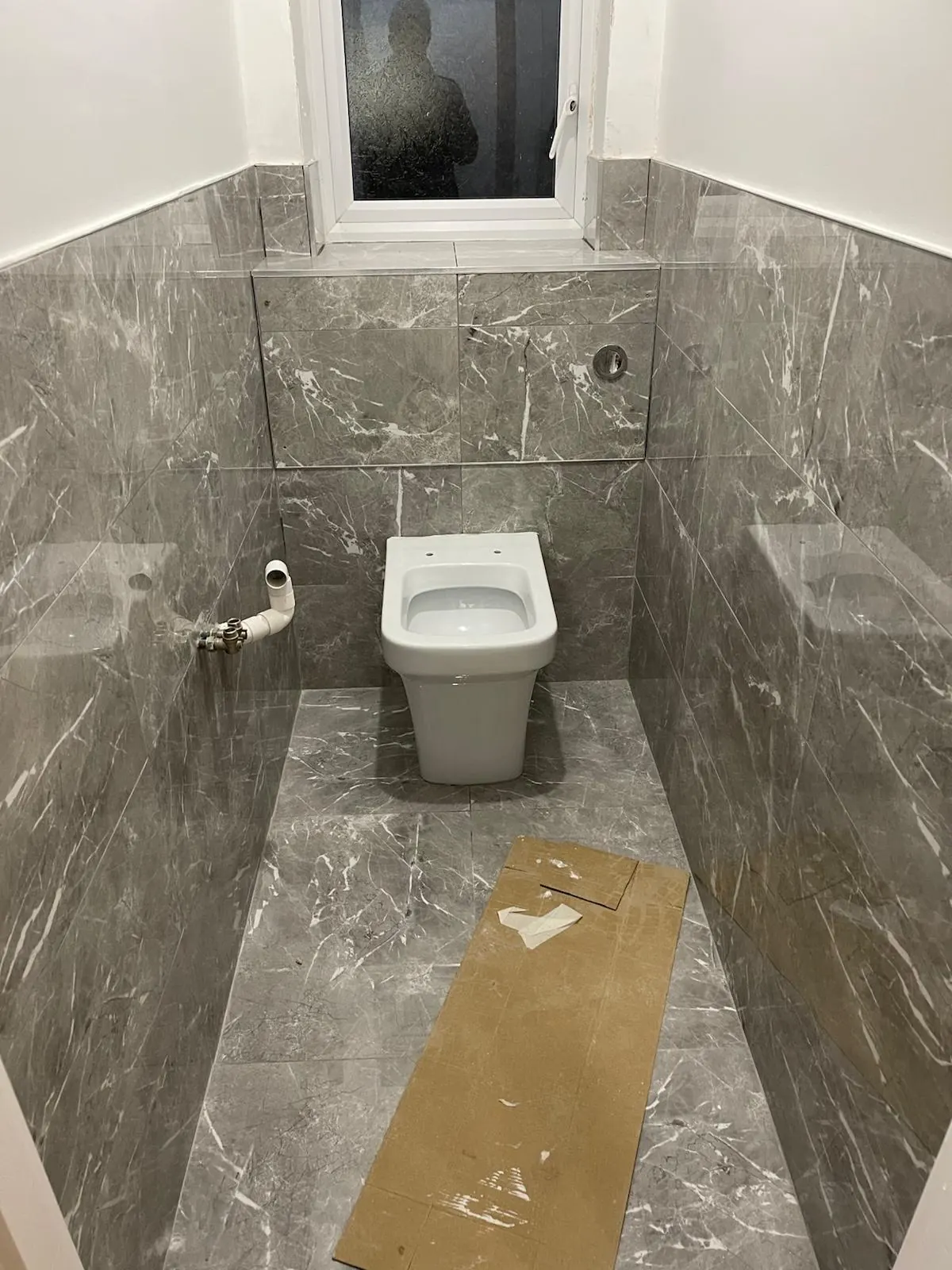 Bathroom tiling in progress