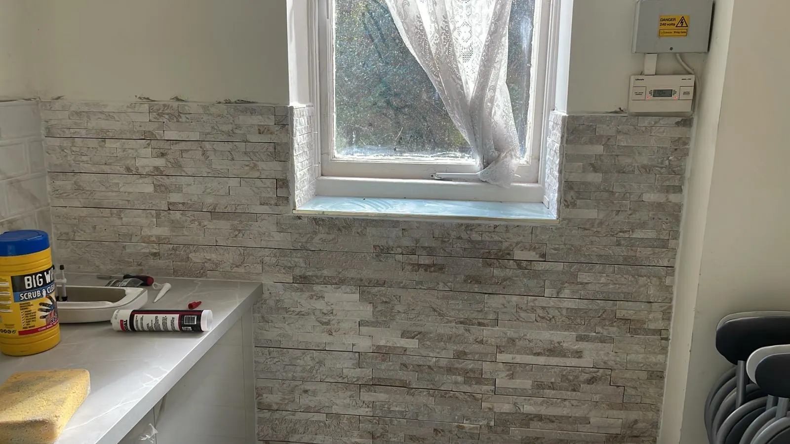 Kitchen wall tiling in progress